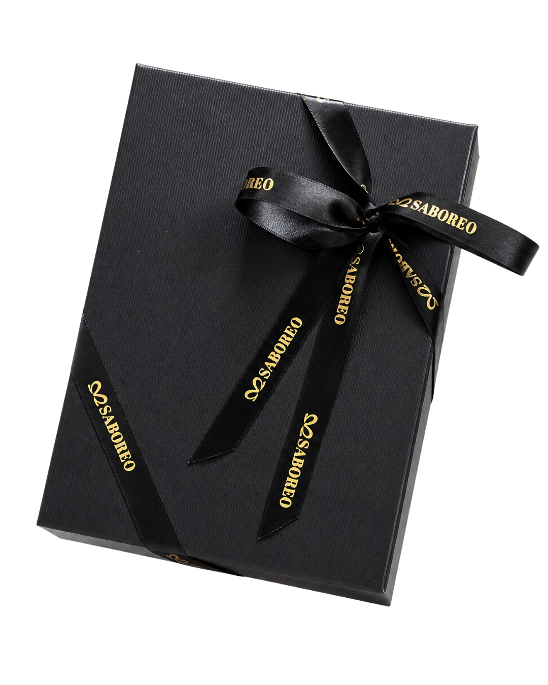 A Saboreo gift box wrapped in black paper with a gold-lettered black ribbon